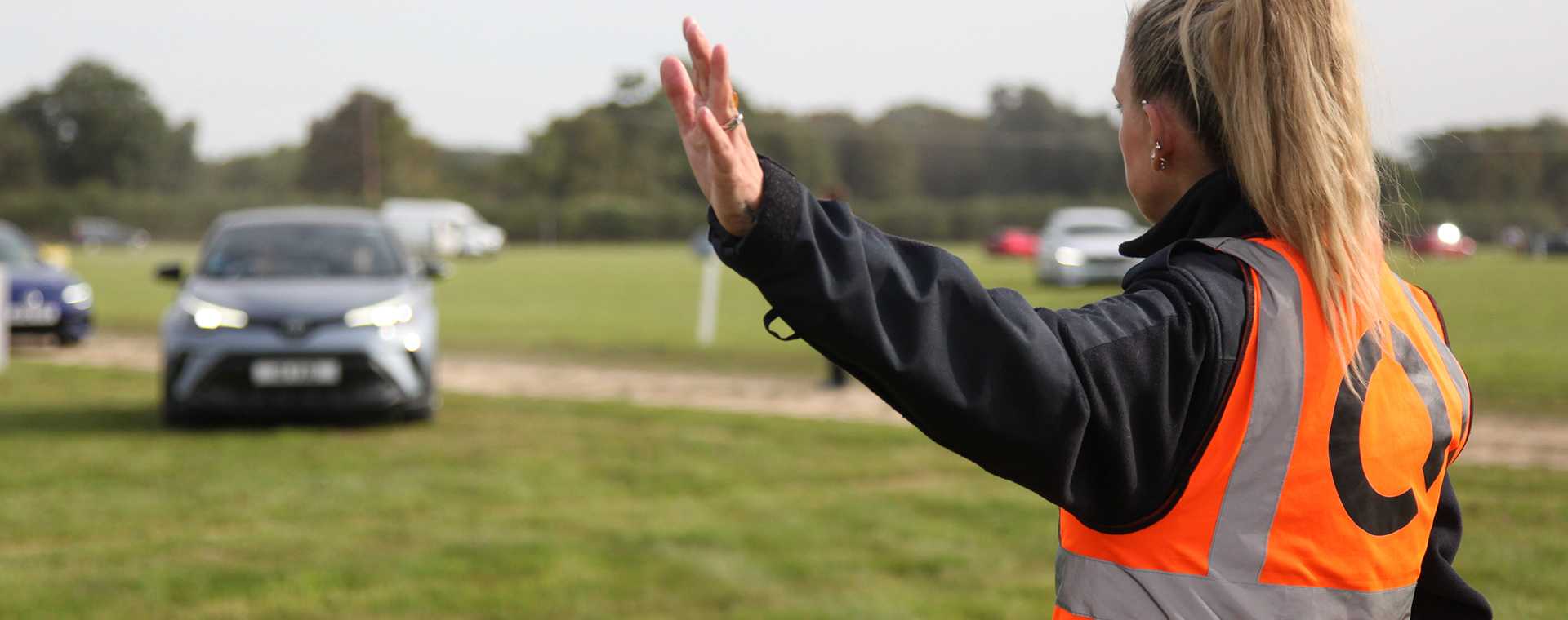 A Tracis Events Marshal directig traffic