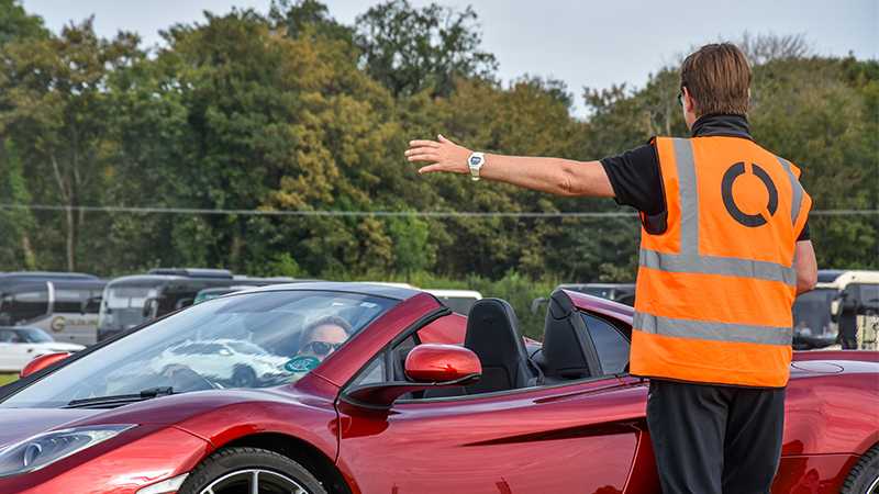 A Tracis Events Marshal assisting a motorist