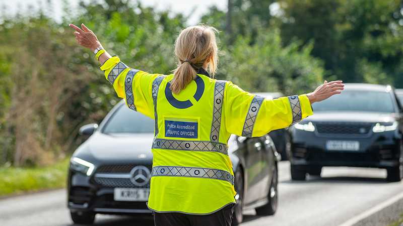 A Tracsis Police Accredited Traffic Officers directing traffic