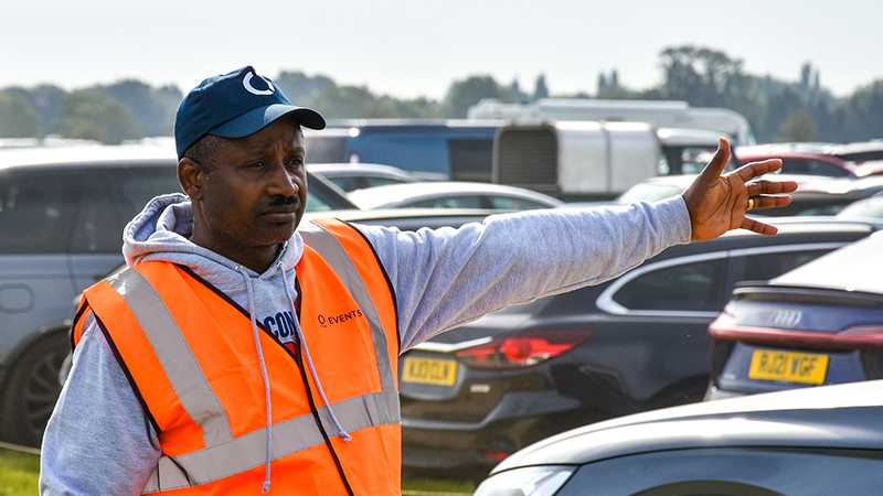 A Tracis Events Marshal directing traffic.